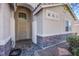 Front door entrance with stone accents and landscaping at 5912 Sea Hunter St, North Las Vegas, NV 89031