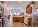 Kitchen with wood cabinets, gas stove, and island at 5912 Sea Hunter St, North Las Vegas, NV 89031