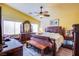 Large main bedroom with wood furniture and a ceiling fan at 5912 Sea Hunter St, North Las Vegas, NV 89031