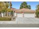 Charming home with a tile roof, manicured front yard, and a two-car garage in a residential neighborhood at 3134 Alfa Romero Ave, North Las Vegas, NV 89031