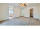 Main bedroom with neutral walls, carpeted floors and ensuite bathroom and walk-in closet access at 3134 Alfa Romero Ave, North Las Vegas, NV 89031