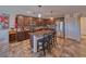 A spacious kitchen featuring granite countertops, stainless steel appliances, and an island with bar seating at 3573 E Garfield Dr, Pahrump, NV 89061