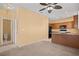 Open concept kitchen and dining area with wood cabinets and granite countertops at 728 Hardy Way # E, Mesquite, NV 89027