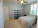 Light and bright bedroom with a single bed, window shutters, and a closet at 735 Diamond Bend Ave, Las Vegas, NV 89123