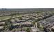 Aerial view of apartment complex near lush green golf course and mature trees at 905 Domnus Ln # 101, Las Vegas, NV 89144