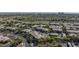Beautiful aerial view of residential community with lush green landscape, sidewalks and mature trees at 905 Domnus Ln # 101, Las Vegas, NV 89144