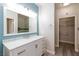 The bathroom features marble countertops and lots of storage at 905 Domnus Ln # 101, Las Vegas, NV 89144