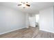 The bedroom has wood-look floors and an ensuite bathroom at 905 Domnus Ln # 101, Las Vegas, NV 89144