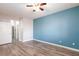 This bedroom has wood-look floors and an ensuite bathroom at 905 Domnus Ln # 101, Las Vegas, NV 89144
