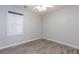 A bright bedroom with a ceiling fan and window with white blinds at 905 Domnus Ln # 101, Las Vegas, NV 89144