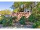 Exterior of community sign surrounded by lush greenery at 905 Domnus Ln # 101, Las Vegas, NV 89144