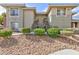 Exterior view of a building with multiple units and desert landscaping at 905 Domnus Ln # 101, Las Vegas, NV 89144