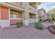 Close up of building exterior with private patios, and desert landscaping at 905 Domnus Ln # 101, Las Vegas, NV 89144