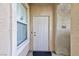 Inviting front door with a neutral color scheme and security features at 905 Domnus Ln # 101, Las Vegas, NV 89144