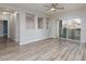 Open concept living room with hardwood floors and sliding doors at 905 Domnus Ln # 101, Las Vegas, NV 89144