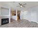 Open living area with fireplace, hardwood floors, and modern kitchen at 905 Domnus Ln # 101, Las Vegas, NV 89144