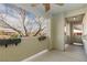 Exterior shot of a patio with planted flowers and a view of a leafless tree at 905 Domnus Ln # 101, Las Vegas, NV 89144