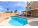 Relaxing backyard oasis featuring a kidney-shaped pool and patio at 1508 Splinter Rock Way, North Las Vegas, NV 89031