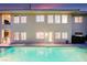 Spacious backyard view featuring a large pool and the home's exterior, perfect for outdoor entertaining at 605 Canyon Greens Dr, Las Vegas, NV 89144