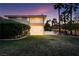 Lush backyard with a spacious lawn, mature trees, and a sparkling pool, ideal for outdoor enjoyment at 605 Canyon Greens Dr, Las Vegas, NV 89144
