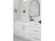Bathroom featuring a white vanity with gold hardware, a black faucet, and a modern mirror at 605 Canyon Greens Dr, Las Vegas, NV 89144