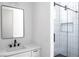 Modern bathroom featuring vanity with undermount sink, quartz countertops, and walk-in shower at 605 Canyon Greens Dr, Las Vegas, NV 89144