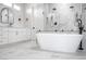 Bright bathroom features a freestanding tub, white vanity, and a luxurious glass enclosed shower at 605 Canyon Greens Dr, Las Vegas, NV 89144