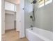 Bathroom featuring a white tub and tile walls with matte black fixtures at 605 Canyon Greens Dr, Las Vegas, NV 89144