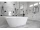 Bathroom features a modern freestanding tub, dual-head shower, and sleek vanity at 605 Canyon Greens Dr, Las Vegas, NV 89144