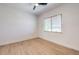 A simple bedroom with ceiling fan and window with light-filtering blinds at 605 Canyon Greens Dr, Las Vegas, NV 89144