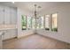 Bright dining room with cabinetry and multiple windows at 605 Canyon Greens Dr, Las Vegas, NV 89144