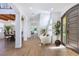 Spacious foyer with hardwood floors, white columns, and an elegant entrance door at 605 Canyon Greens Dr, Las Vegas, NV 89144