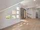 Bright foyer with unique windows, stylish gray door, and staircase leading to the upper level at 605 Canyon Greens Dr, Las Vegas, NV 89144