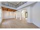 Spacious living room featuring high ceilings, wooden beams, and an open floor plan, perfect for entertaining at 605 Canyon Greens Dr, Las Vegas, NV 89144