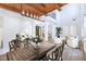 Bright living area with high ceilings, exposed wood beams, and elegant furniture at 605 Canyon Greens Dr, Las Vegas, NV 89144