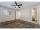 Bedroom with ceiling fan and access to bathroom at 7570 W Flamingo Rd # 201, Las Vegas, NV 89147