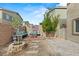 Inviting backyard retreat with a charming stone-paved area, comfortable bench seating, and an American flag-themed accent wall at 9143 Irish Elk Ave, Las Vegas, NV 89149