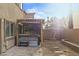 Beautiful backyard with stone pavers, a hot tub under a pergola, and easy-care landscaping perfect for relaxation and entertainment at 9143 Irish Elk Ave, Las Vegas, NV 89149