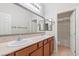 Bathroom featuring double sinks, a large mirror, and tile floors at 9143 Irish Elk Ave, Las Vegas, NV 89149