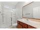 Bathroom featuring a walk-in shower and vanity with a sink and storage at 9143 Irish Elk Ave, Las Vegas, NV 89149
