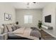 Cozy bedroom with queen bed features minimalist wall art, side tables, and stylish decor at 9143 Irish Elk Ave, Las Vegas, NV 89149