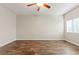 Bedroom boasts vinyl plank flooring, a ceiling fan, and a window for a bright and airy feel at 9143 Irish Elk Ave, Las Vegas, NV 89149