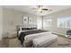 Serene bedroom boasts a plush king bed, soft gray tones, and minimalist decor for a relaxing retreat at 9143 Irish Elk Ave, Las Vegas, NV 89149