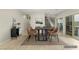 Bright dining area with a contemporary table set, stylish chairs, and easy access to the outdoors at 9143 Irish Elk Ave, Las Vegas, NV 89149