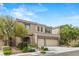 Beautiful two-story home featuring a stone facade, well-maintained landscaping, and a spacious three-car garage at 9143 Irish Elk Ave, Las Vegas, NV 89149