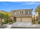 Charming two-story home with a three-car garage, desert landscaping, and appealing exterior at 9143 Irish Elk Ave, Las Vegas, NV 89149