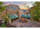 Inviting outdoor fire pit area with built-in seating, perfect for gatherings and relaxation at 9143 Irish Elk Ave, Las Vegas, NV 89149
