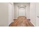 Hallway with hardwood floors and neutral paint, leading to the bedrooms and living spaces at 9143 Irish Elk Ave, Las Vegas, NV 89149