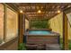Covered hot tub with woven awning, providing a private and relaxing outdoor experience at 9143 Irish Elk Ave, Las Vegas, NV 89149