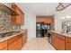 Beautiful kitchen with granite countertops, wooden cabinets, and stainless steel appliances at 9143 Irish Elk Ave, Las Vegas, NV 89149